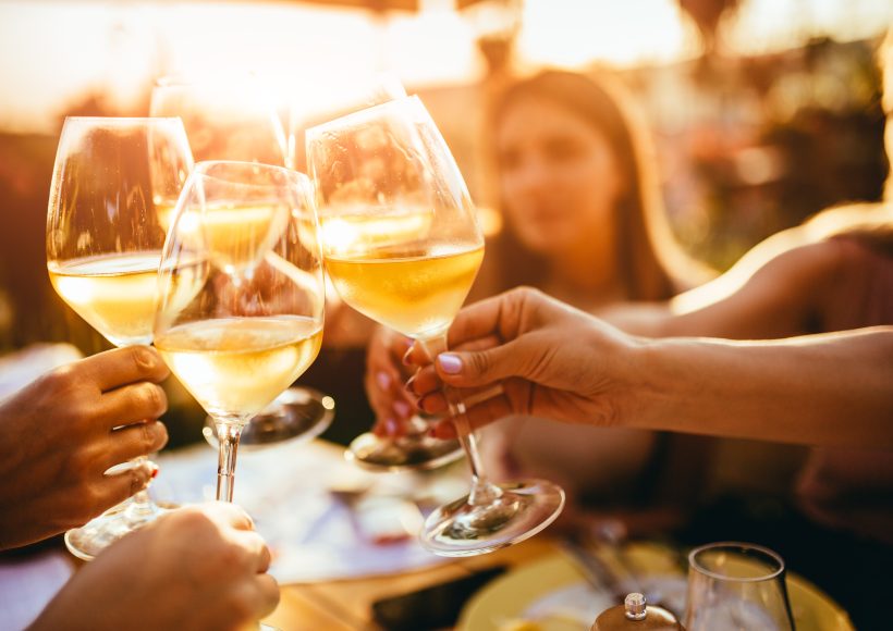 People,Clinking,Glasses,With,Wine,On,The,Summer,Terrace,Of